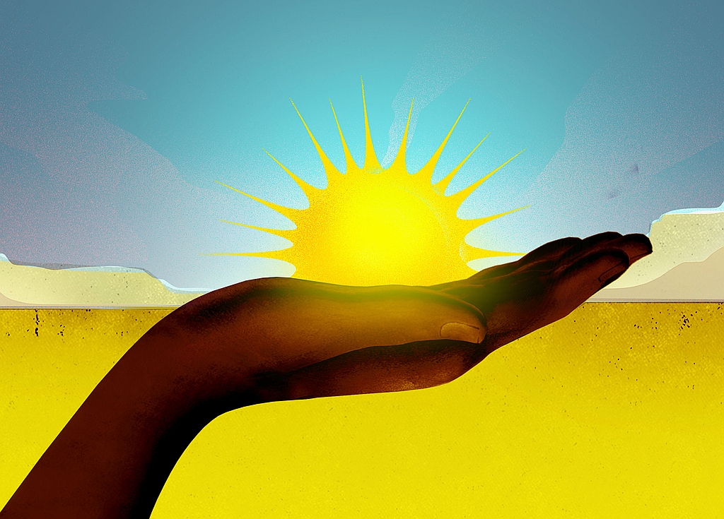 A dark-skinned hand reaches palm-up toward a bright yellow sun on the horizon, against a turquoise sky and yellow field.